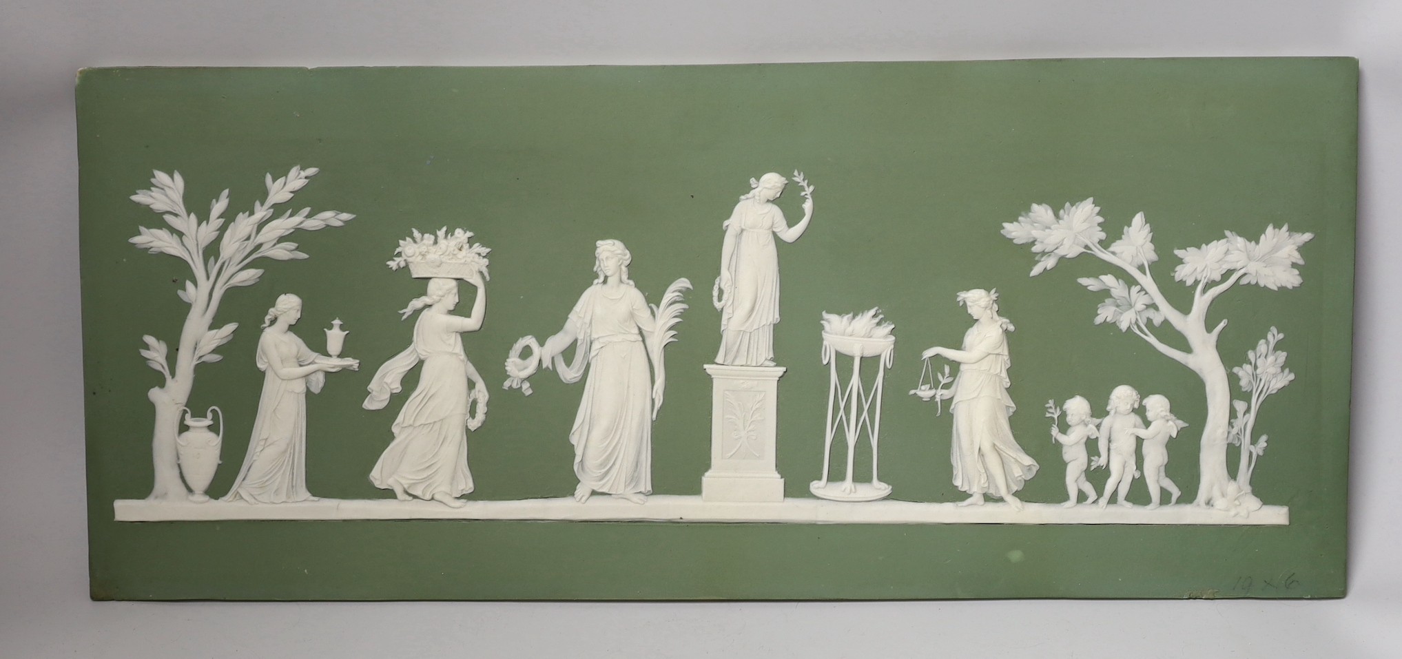 A large early 19th century Wedgwood green jasper plaque with classical reliefs, impressed mark Wedgwood A, 21 x 50cm